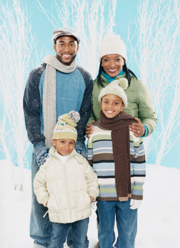 Portrait of Two Parents With Their Young Sons, Wearing Winter Clothing
