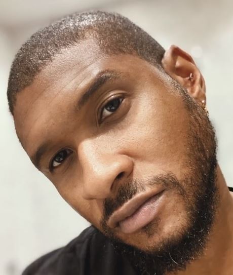 Usher gets a haircut from his kids