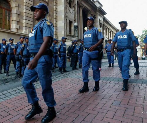 Uniformed SAPS officers dancing, TikTok video of police in amusement, policing culture in South Africa Bona Magazine