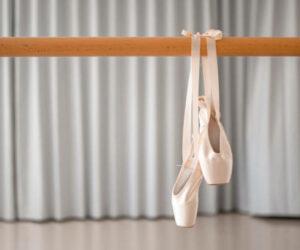 Plus size ballerina at New York Fashion Week, dancing in black tutu, performing en pointe, graceful pirouettes, viral TikTok video, Bona Magazine