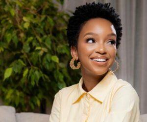 Nandi Madida braided hairstyle close up, flawless skin beauty, South African celebrity portrait, social media viral picture, elegant confidence, Bona Magazine