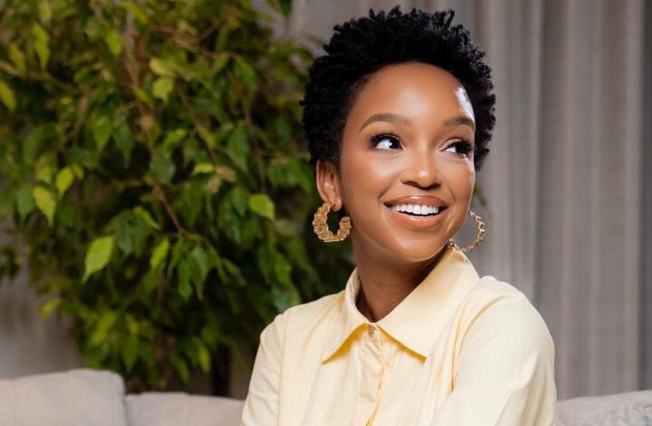 Nandi Madida braided hairstyle close up, flawless skin beauty, South African celebrity portrait, social media viral picture, elegant confidence, Bona Magazine