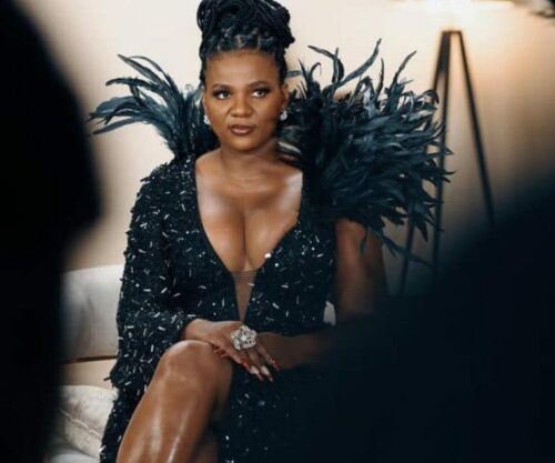 MaMkhize attending red carpet event, luxury champagne bottles lined up for auction, South African Revenue Service auction yard, Bona Magazine