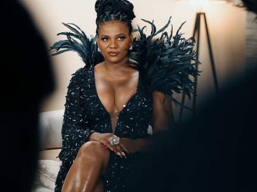 MaMkhize attending red carpet event, luxury champagne bottles lined up for auction, South African Revenue Service auction yard, Bona Magazine