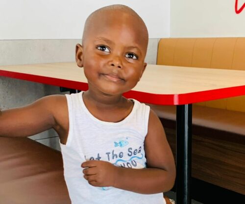 young South African boy talking to his mother, mother wearing wig and child advising, viral family video moment, South African parenting culture, Bona Magazine