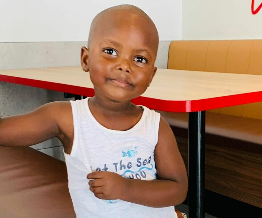young South African boy talking to his mother, mother wearing wig and child advising, viral family video moment, South African parenting culture, Bona Magazine