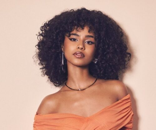 Tyla performing live in concert, South African singer on Asian tour, audience cheering in Bangkok arena, South African music export achievement, Bona Magazine