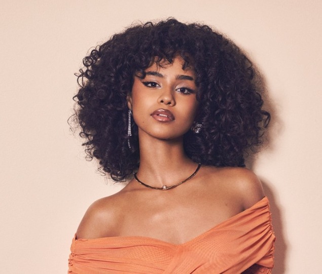 Tyla performing live in concert, South African singer on Asian tour, audience cheering in Bangkok arena, South African music export achievement, Bona Magazine