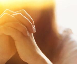 Asian woman in Zulu attire praying, heartfelt makoti prayer moment, intercultural love story, South African viral video, Zulu language fluency, daughter-in-law humour, cross-cultural family life, Bona Magazine