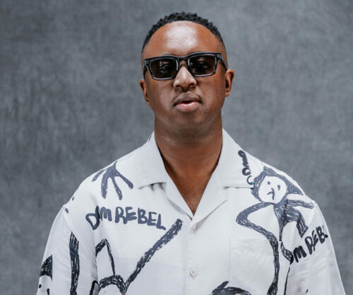 DJ Shimza performing live Johannesburg, Gold Reef City Theme Park exterior Ormonde Johannesburg, South African music festival crowd, Bona Magazine