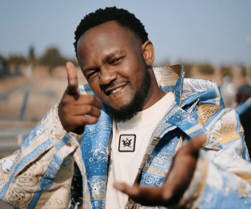 Kwesta performing Spirit live, Rachel viral Nando’s employee speaking on camera, Mam Noxolo Grootboom narrating advert scene, Nando’s advert cast Johannesburg, Kwesta in Nando’s campaign filming, Rachel and Kwesta meeting moment, Spirit music influence South Africa, creative team behind Nando’s advert, Bona Magazine