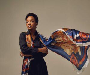 Nandi Madida portrait smiling, South African national anthem sheet music, choir singing Nkosi Sikelel iAfrika history, Bona Magazine