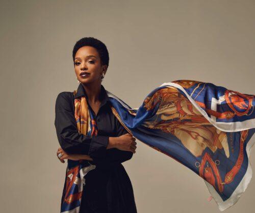 Nandi Madida portrait smiling, South African national anthem sheet music, choir singing Nkosi Sikelel iAfrika history, Bona Magazine