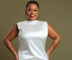 Minnie Ntuli smiling in radio studio, South African radio host Gagasi FM, celebrity pregnancy reveal, broadcaster behind the scenes, Bona Magazine