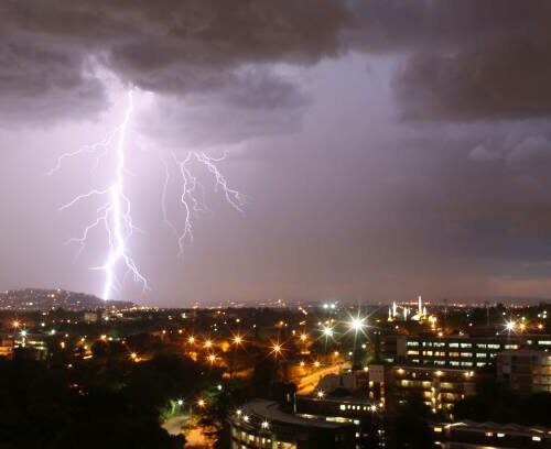 TOPSHOT - Lightenings strike over Johannesburg during a storm on December 14, 2013. AFP PHOTO / ALEXANDER JOE (Photo by ALEXANDER JOE / AFP) (Photo by ALEXANDER JOE/AFP via Getty Images)