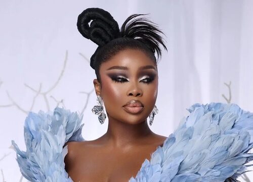 Sithelo Shozi carrying a Bottega Veneta Andiamo handbag, Sithelo Shozi stylish dress Johannesburg, Sithelo Shozi influencer portrait South Africa, Bona Magazine