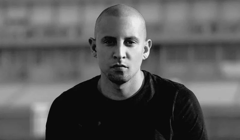 DJ Warras fashion style, DJ Warras black suit, DJ Warras casual outfits, South African DJ style, Bona Magazine, DJ Warras Live AMP look, DJ Warras leather jacket style, DJ Warras sneakers and jeans, men’s fashion South Africa, Bona Magazine