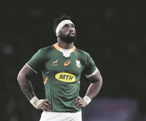 Siya Kolisi laughing with friends, Siya Kolisi TikTok video moment, Siya Kolisi South Africa rugby captain, TikTok gesture South African rugby star, Celebrities trending on TikTok South Africa, Springboks captain off-field fun, Bona Magazine