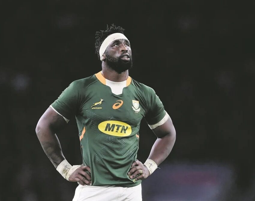 Siya Kolisi laughing with friends, Siya Kolisi TikTok video moment, Siya Kolisi South Africa rugby captain, TikTok gesture South African rugby star, Celebrities trending on TikTok South Africa, Springboks captain off-field fun, Bona Magazine
