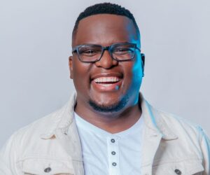 Sol Phenduka smiling studio portrait, Sol Phenduka radio interview Johannesburg, South African celebrity humour moment, Bona Magazine