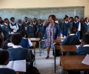 A teacher speaks to students at a class