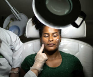 Young woman doing a facial treatment at a spa