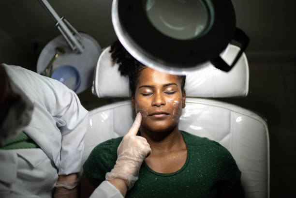 Young woman doing a facial treatment at a spa