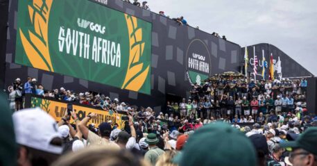 LIV Golf Steyn City brawl video, Johannesburg golf crowd fight, Dean Burmester dance moment, Bafana Bafana shirt golf event, Bryson DeChambeau LIV Golf win, South African sports crowd reaction, viral fight video SA event, LIV Golf concert Black Coffee Calvin Harris, Steyn City golf atmosphere, large crowd Johannesburg event, Bona Magazine