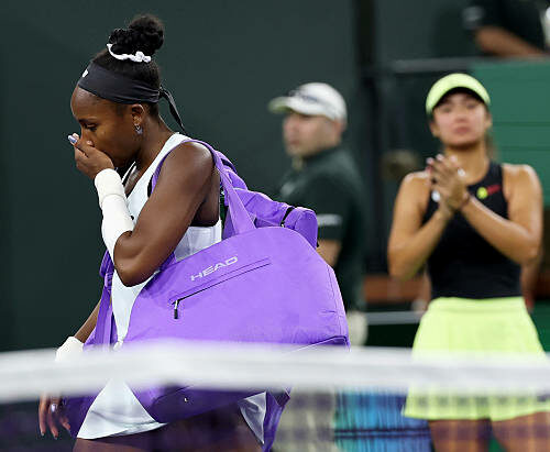 INDIAN WELLS, CALIFORNIA - MARCH 08: Coco Gauff of the United States walks off court showing her emotion after she has retired with an arm injury against Alexandra Eala of the Phiippines during their third round match of the BNP Paribas Open at Indian Wells Tennis Garden on March 08, 2026 in Indian Wells, California. (Photo by Clive Brunskill/Getty Images)