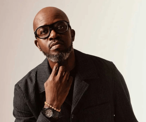 Black Coffee 50th birthday, Black Coffee old outfit photo, Black Coffee viral fashion moment, South African DJ Black Coffee celebration, Black Coffee social media reactions, Black Coffee music career milestone, African house music DJ legend, Grammy winning DJ Black Coffee, viral celebrity fashion moment SA, Bona Magazine