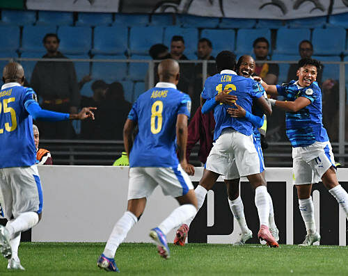 Sundowns' players celebrate after scoring their first goal during the CAF Champions League semi-final first leg football match between Esperance Sportive de Tunis (TUN) and Mamelodi Sundowns (RSA) at the Hammadi Agrebi Stadium in Rades on April 12, 2026. (Photo by FETHI BELAID / AFP via Getty Images)