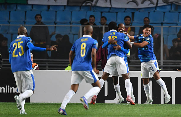 Sundowns' players celebrate after scoring their first goal during the CAF Champions League semi-final first leg football match between Esperance Sportive de Tunis (TUN) and Mamelodi Sundowns (RSA) at the Hammadi Agrebi Stadium in Rades on April 12, 2026. (Photo by FETHI BELAID / AFP via Getty Images)