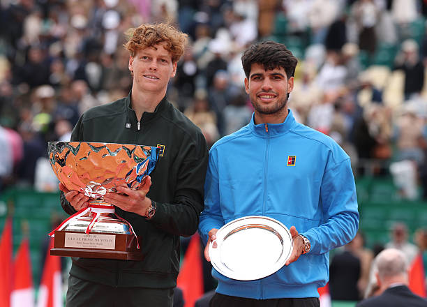 MONTE-CARLO, MONACO - APRIL 12: Jannik Sinner of Italy and Carlos Alcaraz of Spain pose for a photo with their winners and runners-up trophies after the Men's Singles Final during day eight of the Rolex Monte-Carlo Masters at Monte-Carlo Country Club on April 12, 2026 in Monte-Carlo, Monaco. (Photo by Julian Finney/Getty Images)