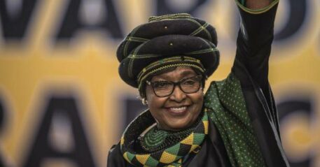The former wife of the late South African President Nelson Mandela, anti-apartheid campaigner Winnie Mandela waves as she attends the 54th ANC National Conference at the NASREC Expo Centre in Johannesburg on December 16, 2017. Thousands of delegates from South Africa's ANC party gathered on December 16, 2017 for a five-day meeting to elect their new leader in a divisive race seen as a pivotal moment in the country's post-apartheid history. he winner will be well placed to be the next president, but the ANC has lost much popularity since Nelson Mandela led it to power in the euphoric 1994 election that marked the end of white-minority rule. / AFP PHOTO / MUJAHID SAFODIEN (Photo credit should read MUJAHID SAFODIEN/AFP via Getty Images)