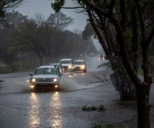 Automobiles on a flooded road in the Tokai suburb of Cape Town, South Africa, on Thursday, July 11, 2024. Cape Town, South Africa's tourism hub, and the surrounding Western Cape province have been battered by torrential rains, howling winds and bush fires that caused extensive damage to buildings, roads and other infrastructure.  Photographer: Dwayne Senior/Bloomberg via Getty Images