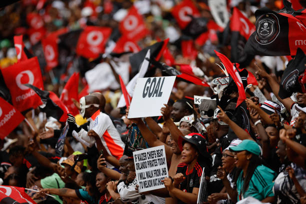 Orlando Pirates fans celebrate their team's win during the Premier Soccer League (PSL) South African Premier Division football match between Orlando Pirates and Kaizer Chiefs at the FNB Stadium in Johannesburg on February 1, 2025. (Photo by Phill Magakoe / AFP) (Photo by PHILL MAGAKOE/AFP via Getty Images)