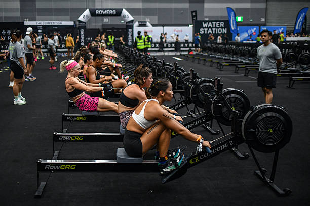 Participants compete in the "rowing" event during the Hyrox fitness race at the Bangkok International Trade and Exhibition Centre (BITEC) in Bangkok on March 21, 2026. (Photo by Amaury PAUL / AFP via Getty Images)