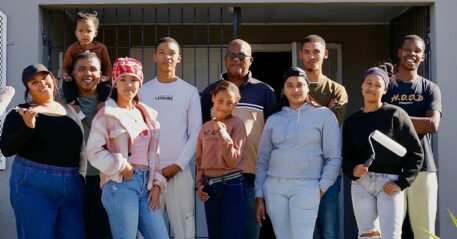Cape Flats youth paint the walls in their area.