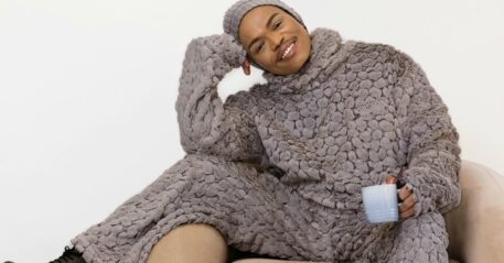 Somizi showed himself cooking with a fan.