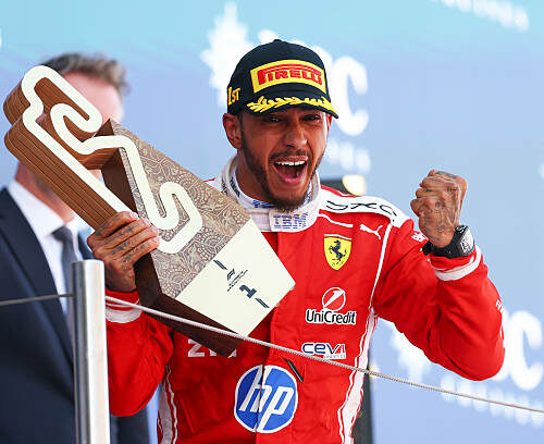 BARCELONA, SPAIN - JUNE 14: Race winner Lewis Hamilton of Great Britain and Scuderia Ferrari celebrates on the podium with his trophy during the F1 Grand Prix of Barcelona-Catalunya at Circuit de Barcelona-Catalunya on June 14, 2026 in Barcelona, Spain. (Photo by Clive Mason/Getty Images)